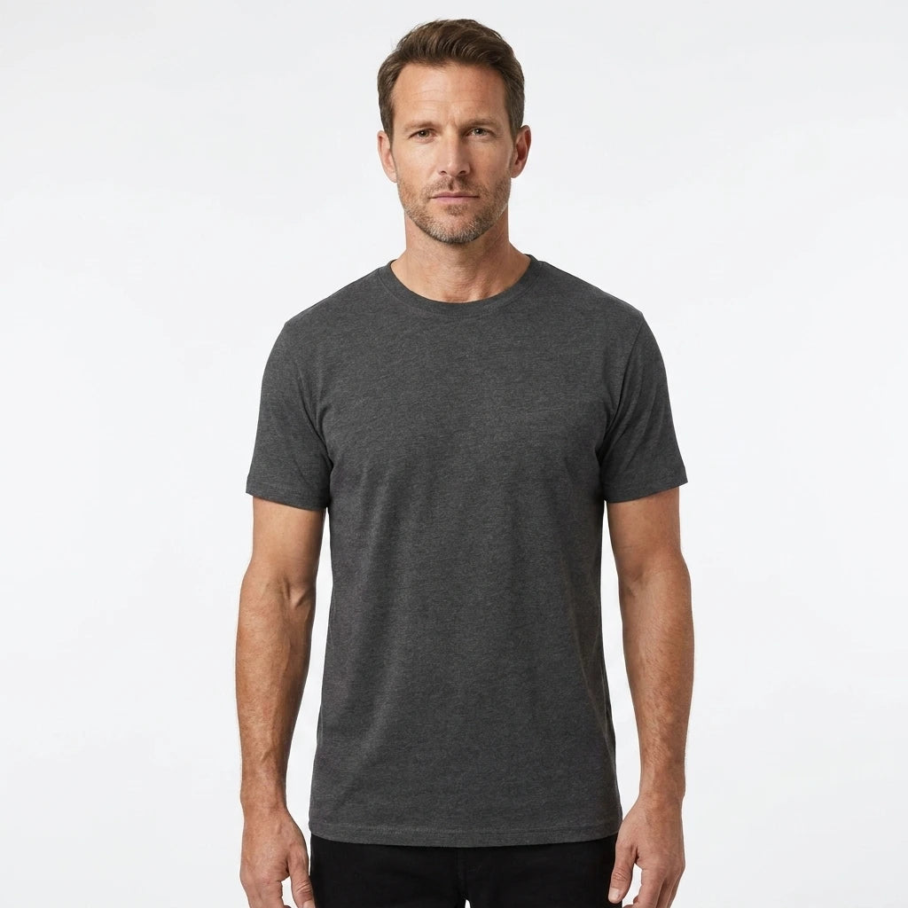 T-Time T-shirt, Koks grå 0510 | Studio portrait of a 45-year-old man, athletic build, short brown hair, light stubble, neutral confident expression, standing against a plain white seamless stu