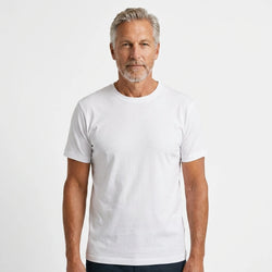 T-Time T-shirt, Hvid 0510 | Studio portrait of a 45-year-old man, athletic build, short brown hair, light stubble, neutral confident expression, standing against a plain white seamless stu