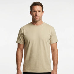 T-Time T-shirt, Kit 0510 | Studio portrait of a 45-year-old man, athletic build, short brown hair, light stubble, neutral confident expression, standing against a plain white seamless stu