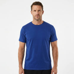 T-Time T-shirt, Kongeblå 0510 | Studio portrait of a 45-year-old man, athletic build, short brown hair, light stubble, neutral confident expression, standing against a plain white seamless stu