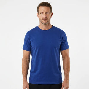 T-Time T-shirt, Kongeblå 0510 | Studio portrait of a 45-year-old man, athletic build, short brown hair, light stubble, neutral confident expression, standing against a plain white seamless stu