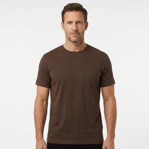 T-Time T-shirt, Mocca/Brun 0510 | Studio portrait of a 45-year-old man, athletic build, short brown hair, light stubble, neutral confident expression, standing against a plain white seamless stu