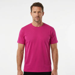 T-Time T-shirt, Pink 0510 | Studio portrait of a 45-year-old man, athletic build, short brown hair, light stubble, neutral confident expression, standing against a plain white seamless stu