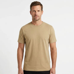 T-Time T-shirt, Sand 0510 | Studio portrait of a 45-year-old man, athletic build, short brown hair, light stubble, neutral confident expression, standing against a plain white seamless stu