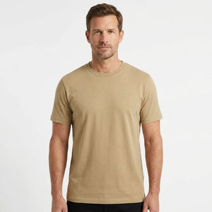 T-Time T-shirt, Sand 0510 | Studio portrait of a 45-year-old man, athletic build, short brown hair, light stubble, neutral confident expression, standing against a plain white seamless stu