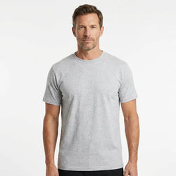 T-Time T-shirt, Snow Melange 0510 | Studio portrait of a 45-year-old man, athletic build, short brown hair, light stubble, neutral confident expression, standing against a plain white seamless stu